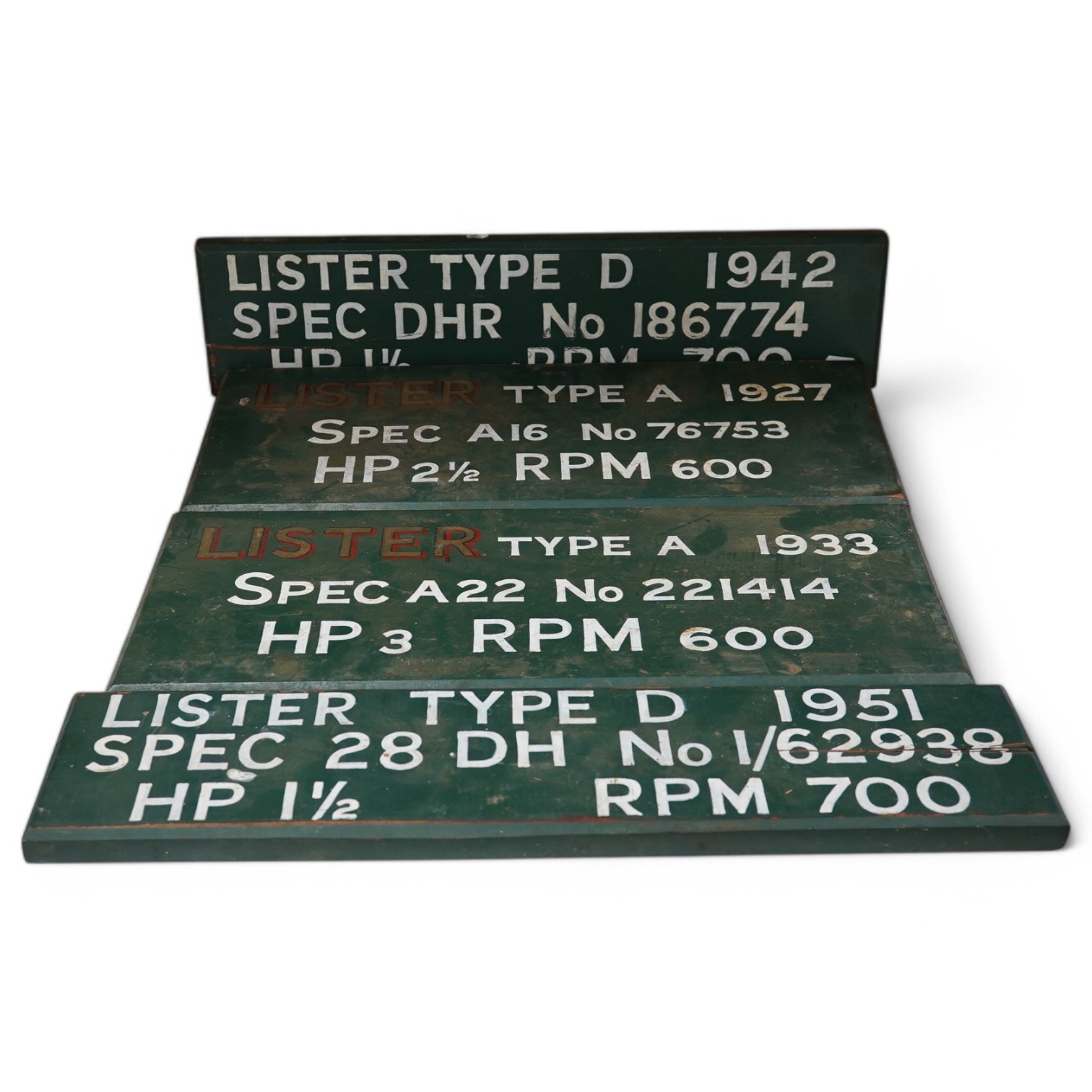 Four Lister engine painted wooden signs, dated: 1927 1933 1942 and 1951. Widest 56cm. Condition - worn in places